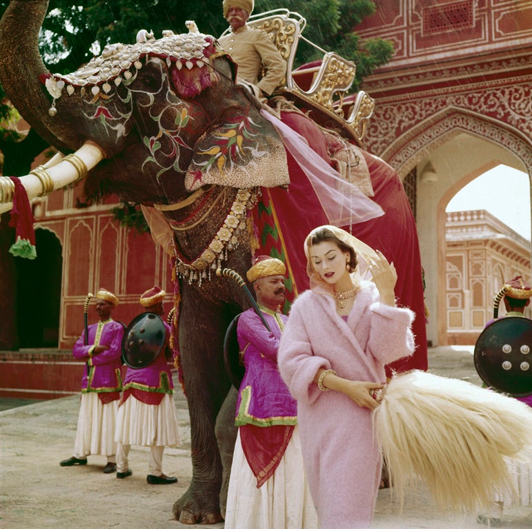 Norman Parkinson, Anne Gunning in a Pink Mohair Coat outside the City Palace, Jaipur, India, for Vogue November,1956