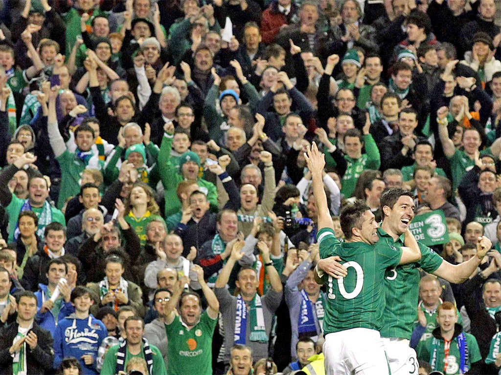 Robbie Keane (No 10), Stephen Ward and the Irish fans enjoy the Republic's goal in Dublin last night