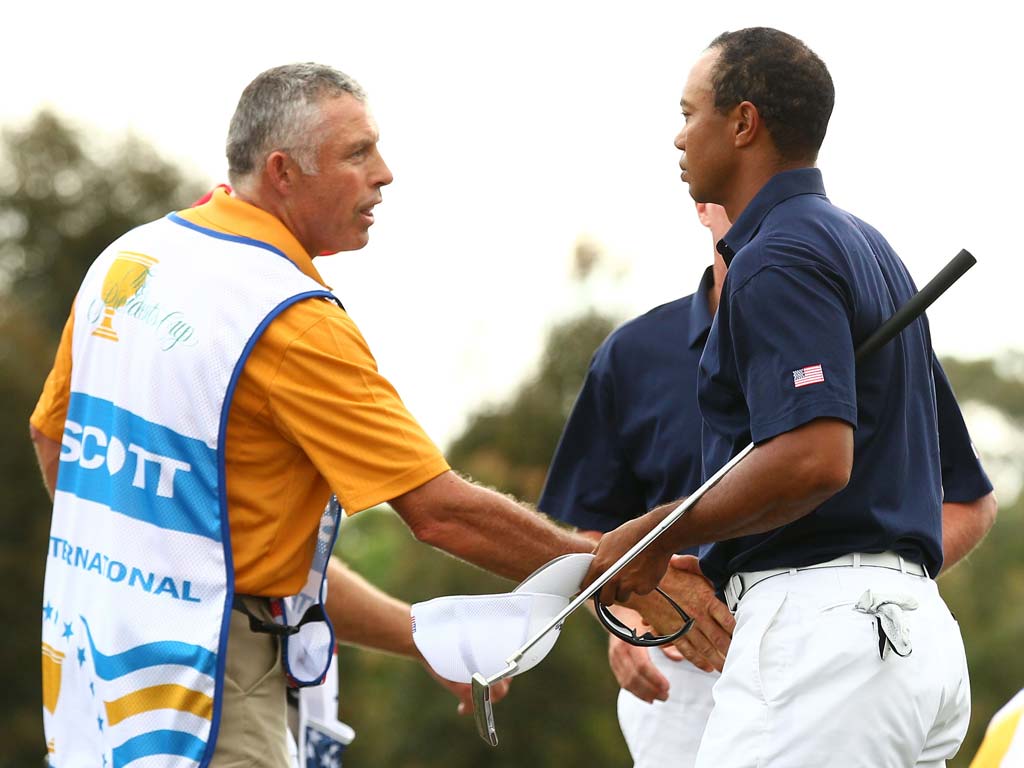 Tiger Woods shakes hands with former caddie Steve Williams