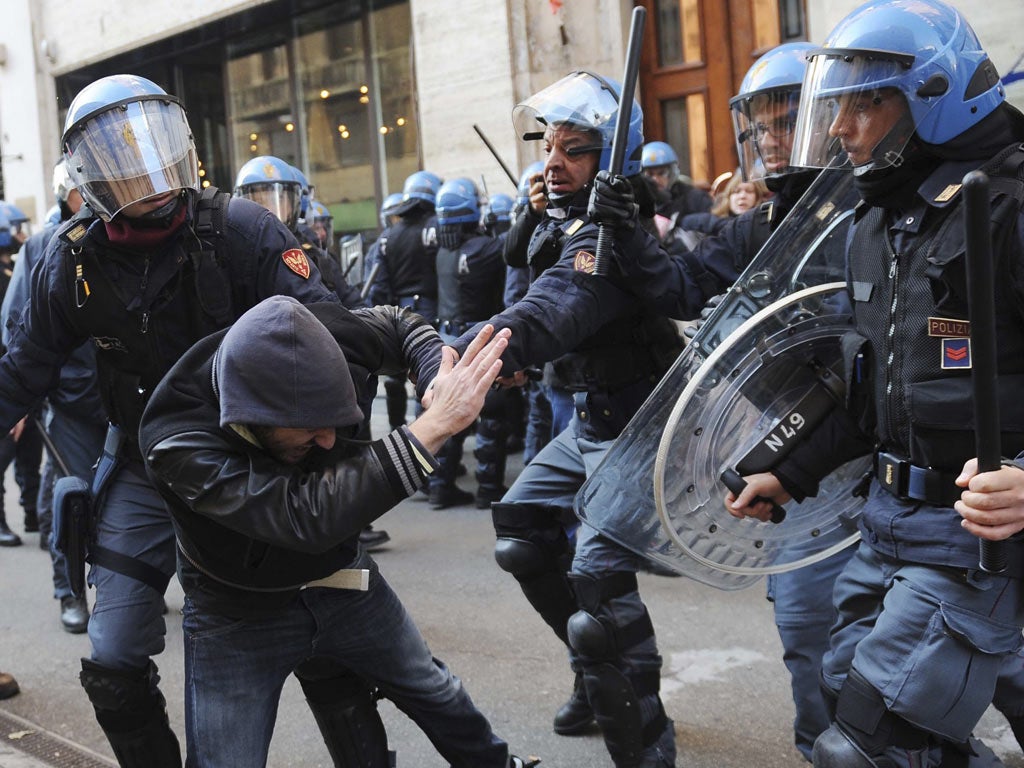 Students clash with police during a demonstration in Turin
