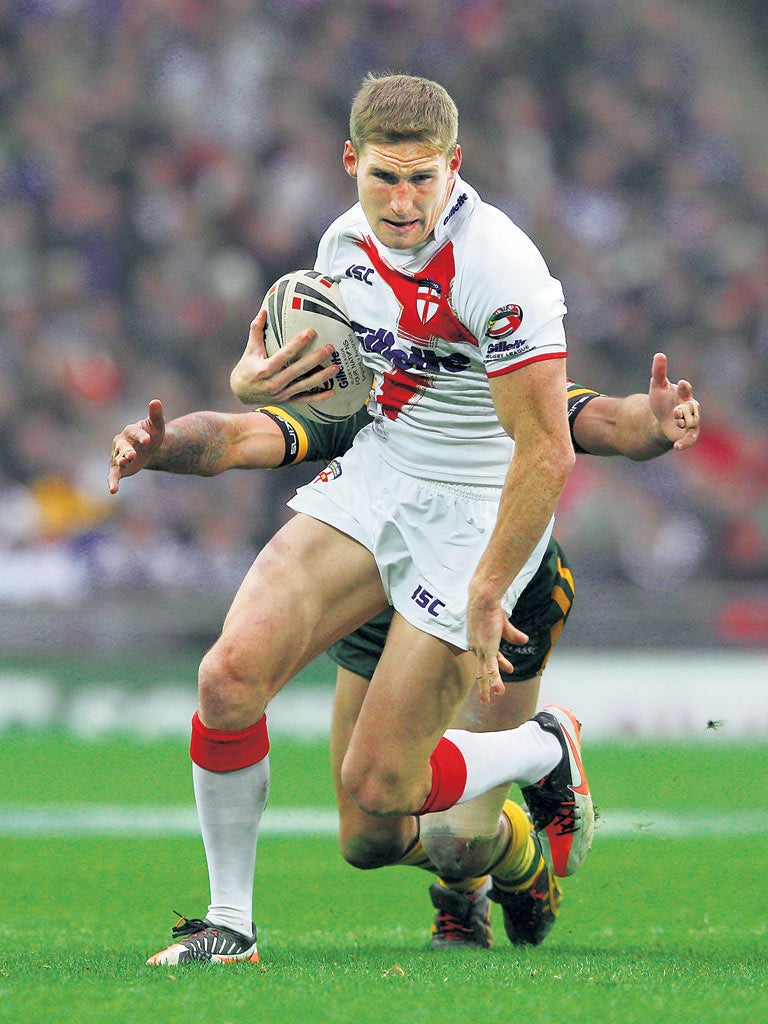 Sam Tomkins evades a tackle during England’s Wembley defeat by Australia