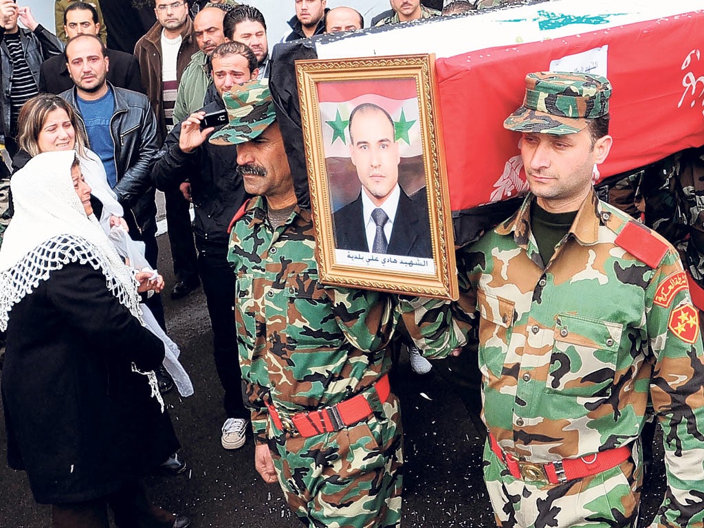 The funeral procession of Sergeant Hadi Ali Baldiah, killed by rebels, leaves a military hospital in Damascus