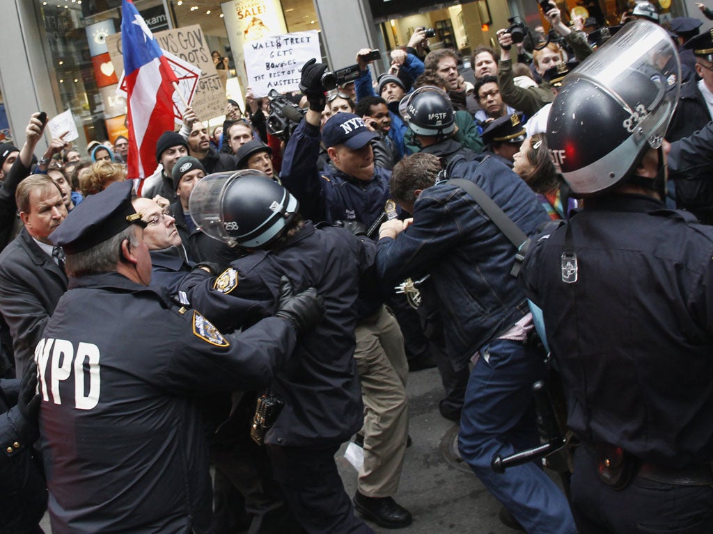 <b>New York</b><br/> Bloody scuffles broke out in New York as more than 100 protesters were arrested trying to close down Wall Street, despite a lower turn-out than expected.
