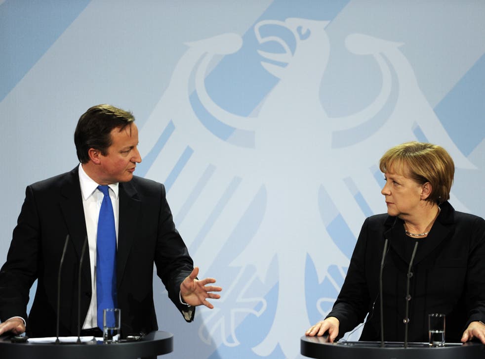 David Cameron and Angela Merkel struggle to disguise their different strategies on tackling the eurozone crisis