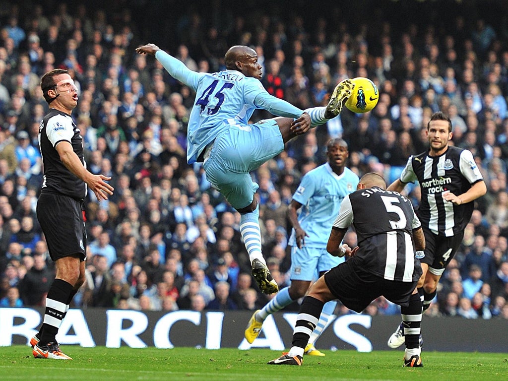 Manchester City striker Mario Balotelli leaps high to control the ball brilliantly against Newcastle at the Etihad Stadium yesterday