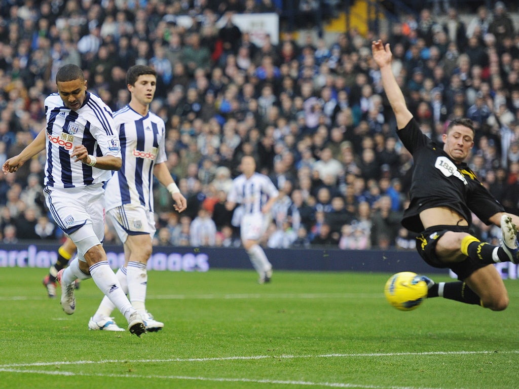 Jerome Thomas (left) opens the scoring for West Bromwich against Bolton during an assured display on the left flank