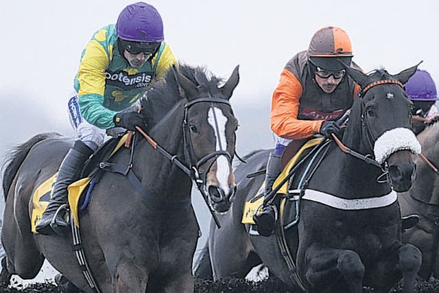 Ruby Walsh stirs the emotions by steering Kauto Star (left) to a fourth victory in the Betfair Chase