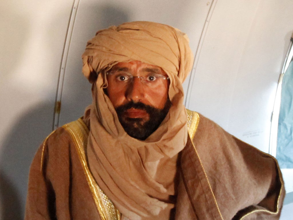 Saif Gaddafi on a flight to Zintan after his arrest yesterday
