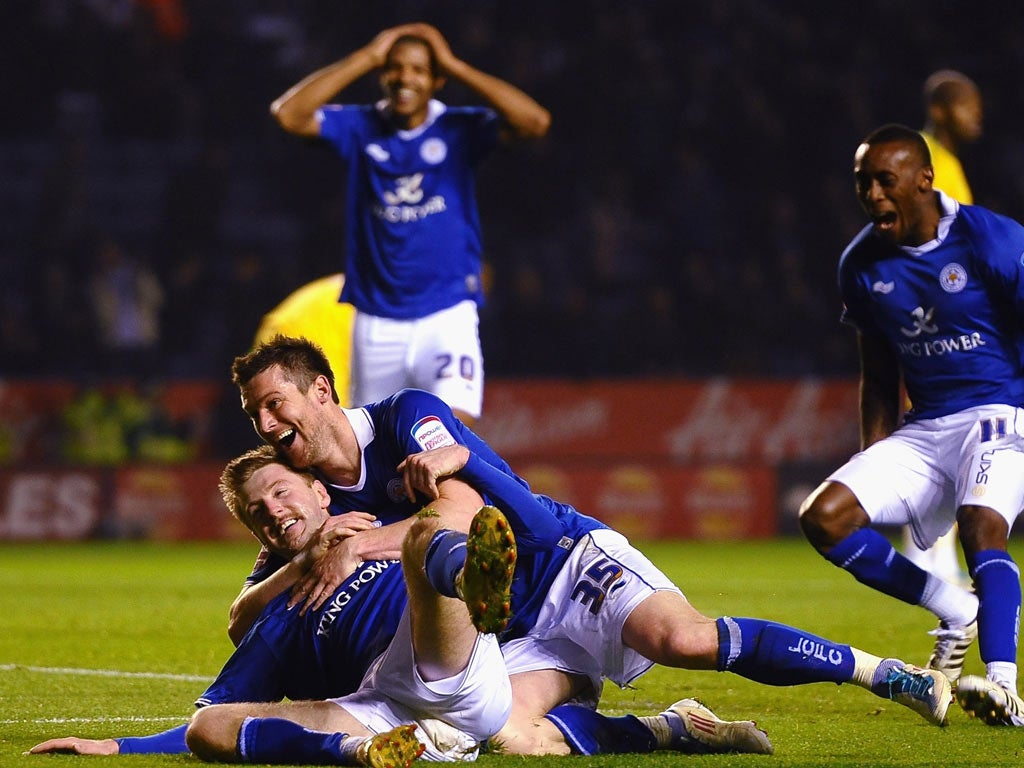 Paul Gallagher celebrates Leicester’s third goal with David Nugent