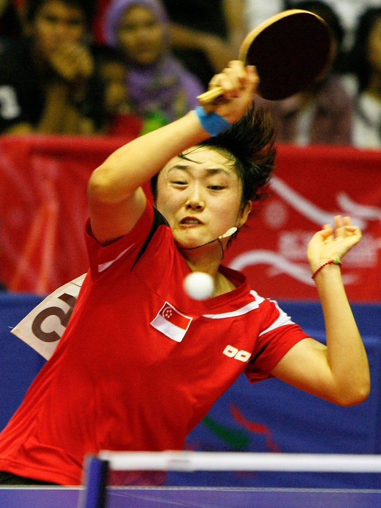 Singapore’s Feng Tian Wei
takes the game rather
more seriously at the
SouthEastAsian Games
earlier this month