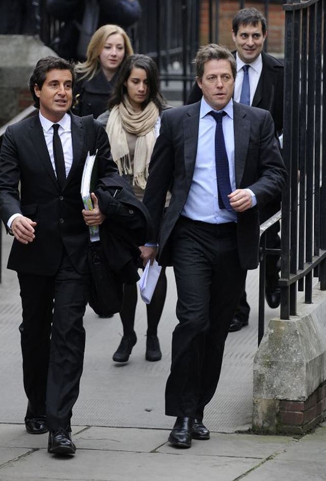 Hugh Grant arrives at the Leveson Inquiry at the High Court in London 