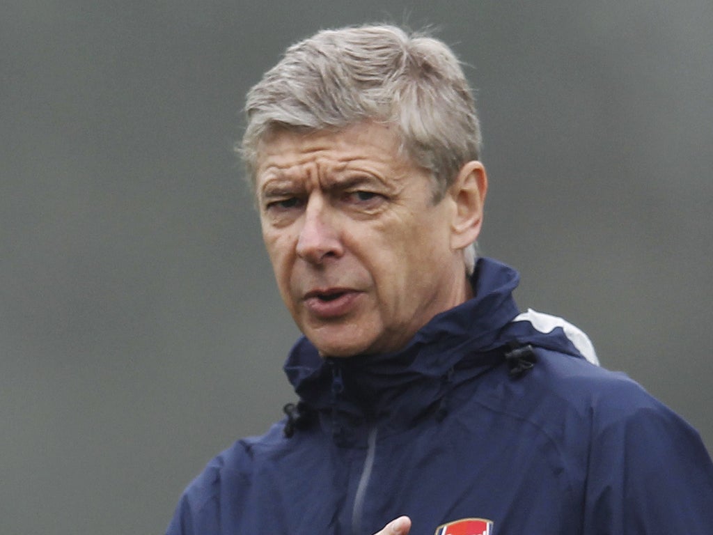 Arsène Wenger takes training ahead of tonight's vital match with Borussia Dortmund