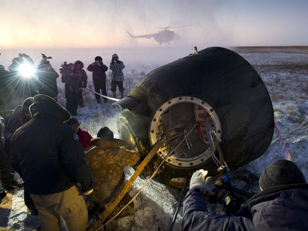 The crew landed shortly before sunrise in central Kazakhstan