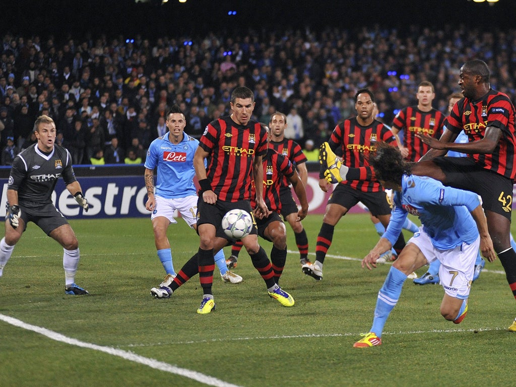 Edinson Cavani heads in his first goal against Manchester City last night