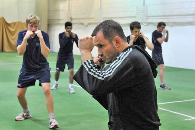 Mixed martial arts trainer - and fighter - Giorgio Andrews puts the Middlesex players through their paces