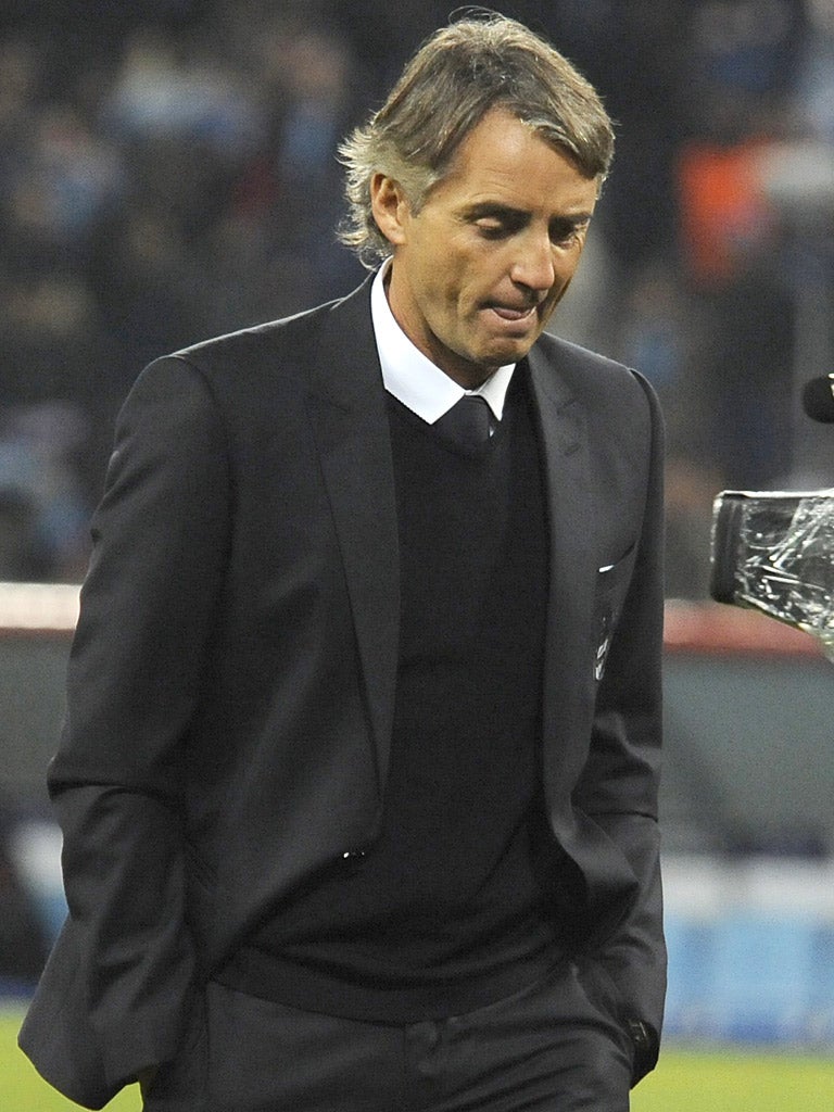 Roberto Mancini is torn between a desire to attack and defend