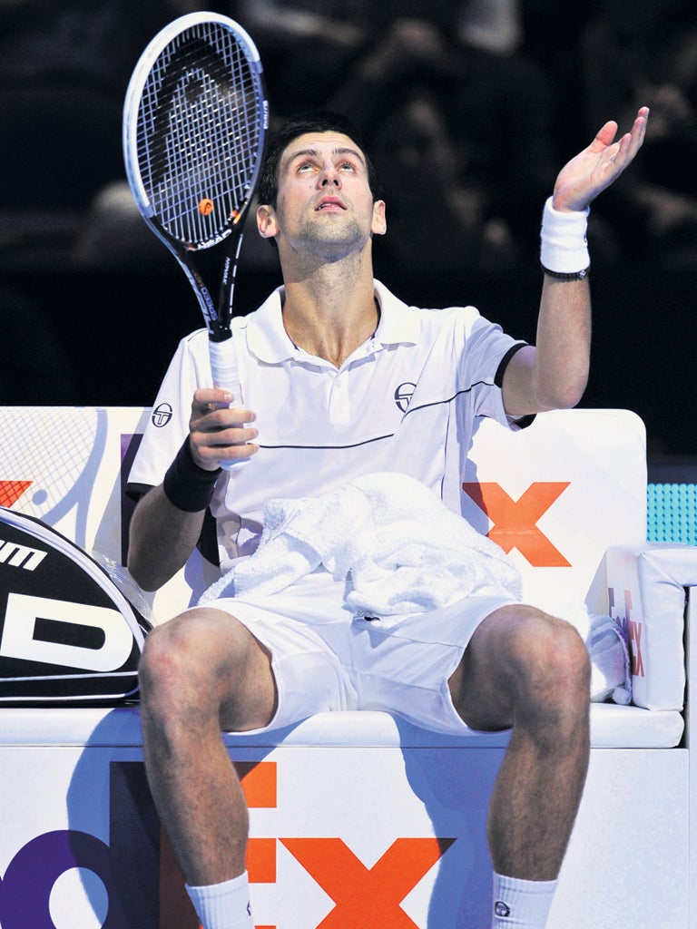 Novak Djokovic looks for help from above. The world No 1 looked spent during another defeat