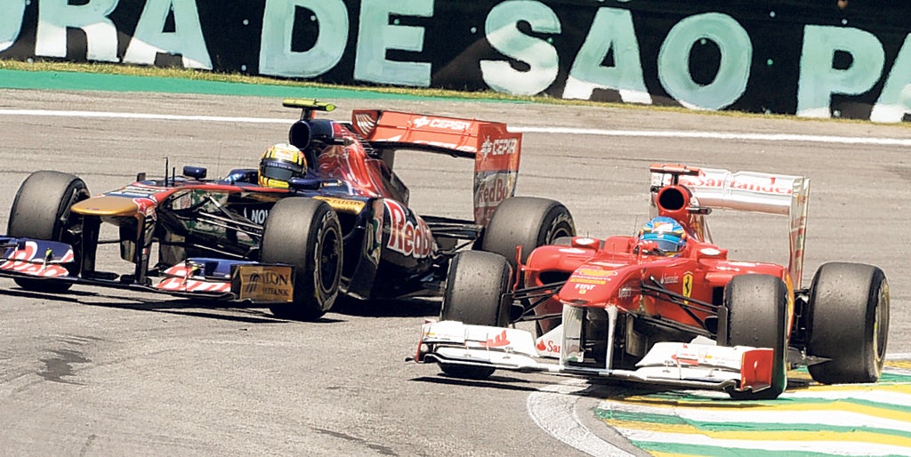 Fernando Alonso’s Ferrari and Jaime Alguersuari in the Toro Rosso practise at Interlagos