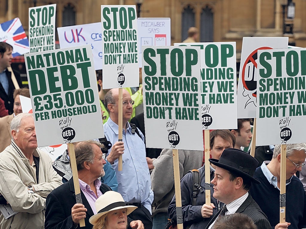 Demonstrators in London this year calling for an end to national debt. It is estimated that Britons will have £2 trillion in debt by 2015
