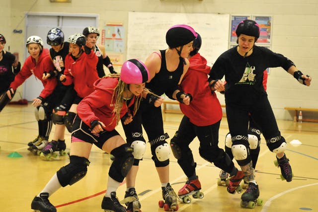 Blockers take on the jammers as the London Roller Girls train for the first ever World Cup
