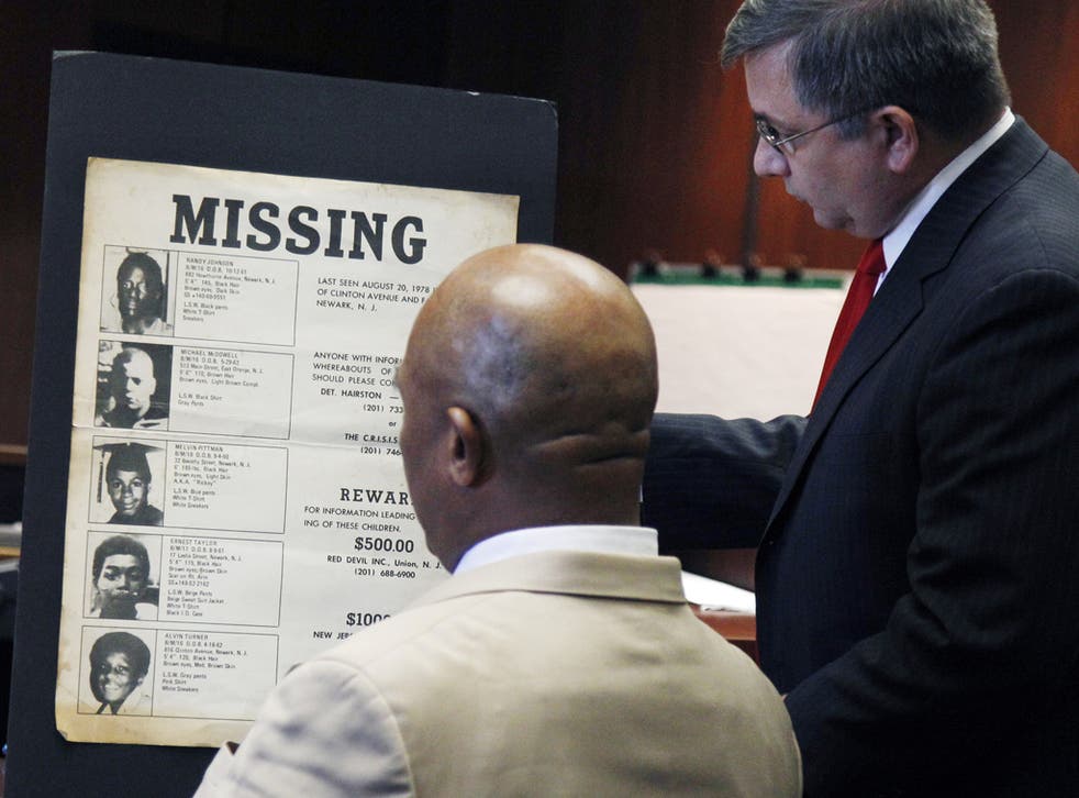 Lee Evans is shown a poster of the missing teenagers during his trial