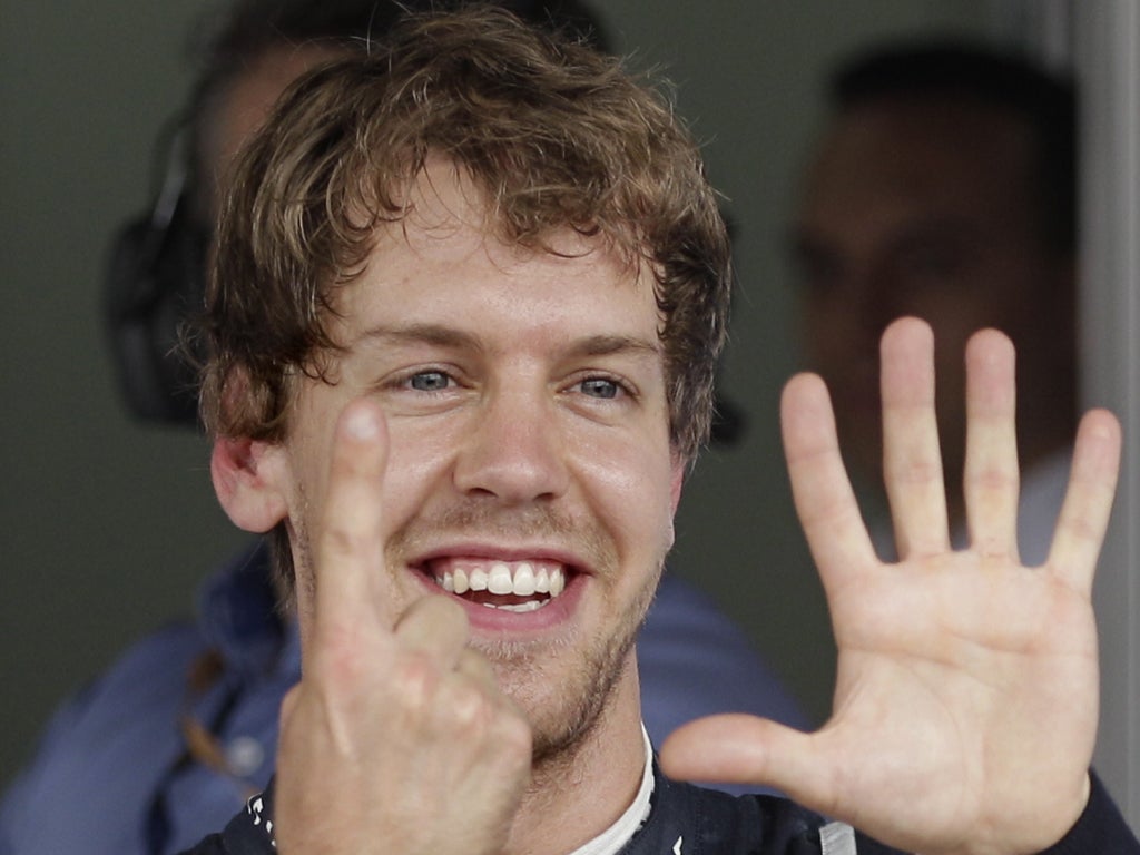 Vettel signals his achievement after a scintillating lap in Brazil