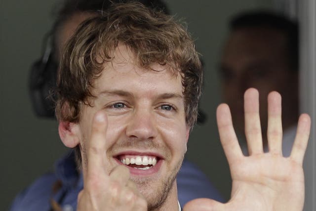 Vettel signals his achievement after a scintillating lap in Brazil