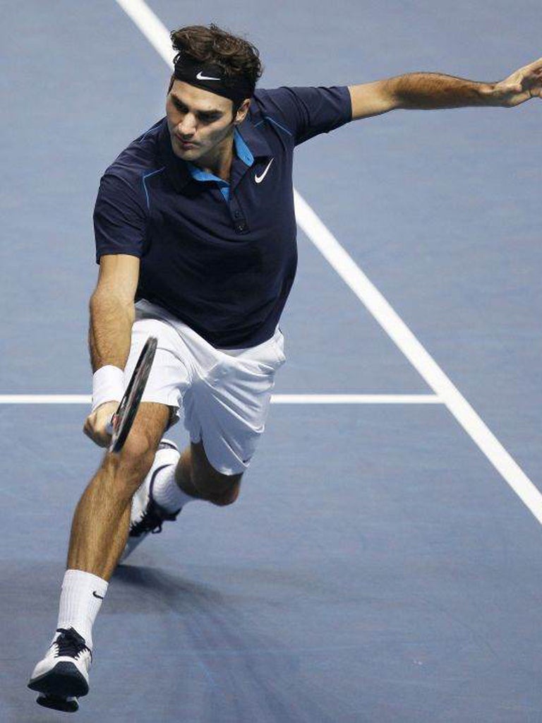 Roger Federer on his way to a 7-5 6-3 victory over David Ferrer at the O2 Arena yesterday to reach the 100th final of his career