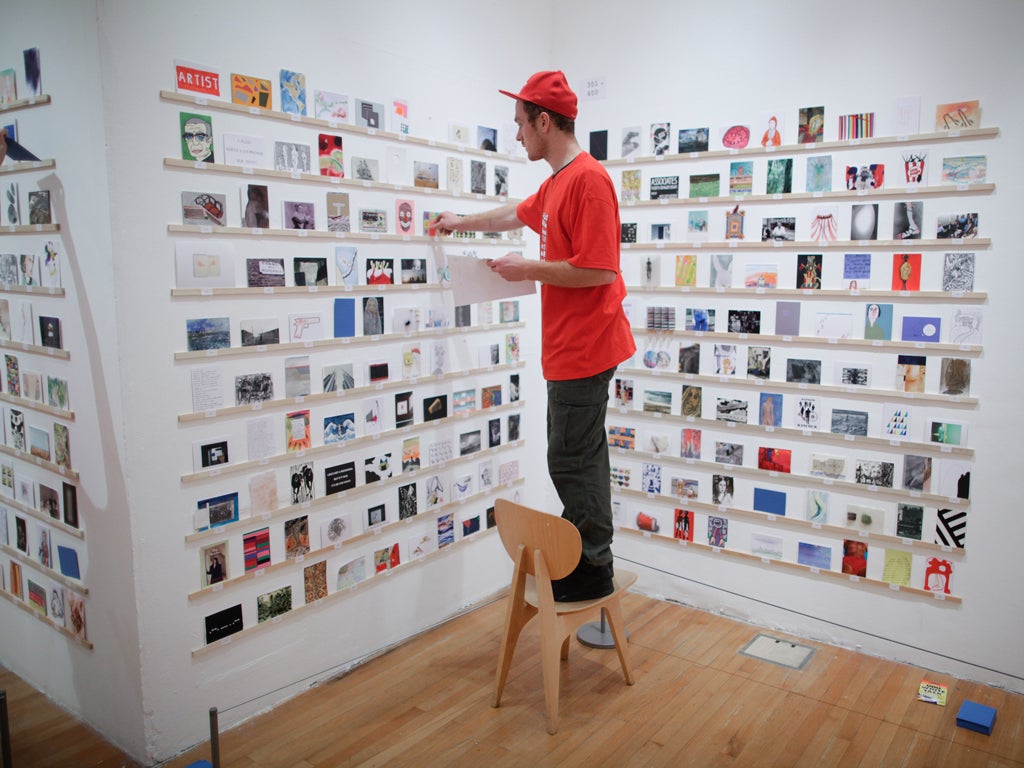 Gallery staff prepared the display as buyers waited outside