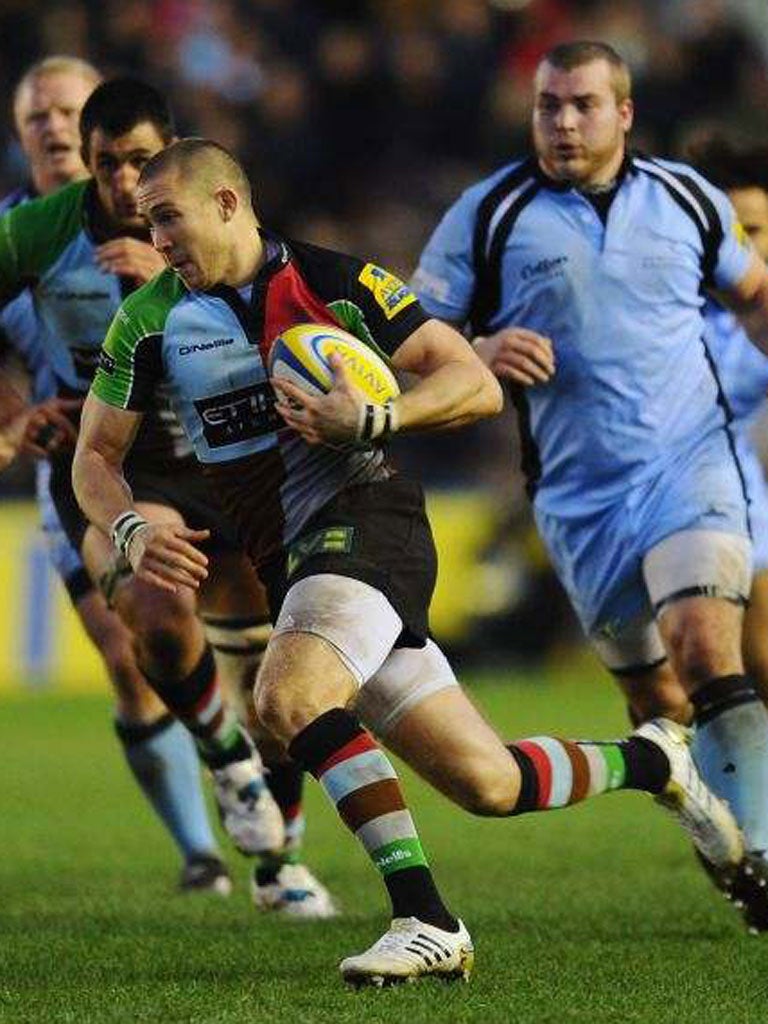 Mike Brown runs in one of Harlequins’ six tries yesterday