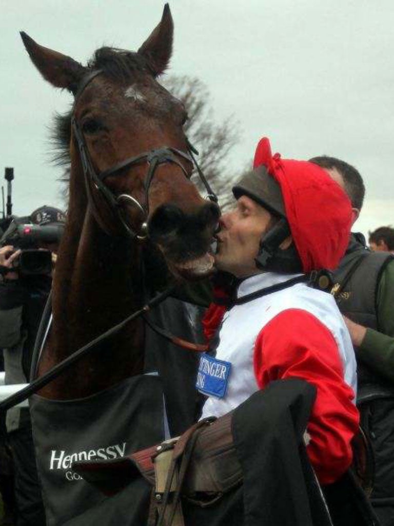 Carruthers gets a kiss from jockey Mattie Batchelor after their Hennessy win