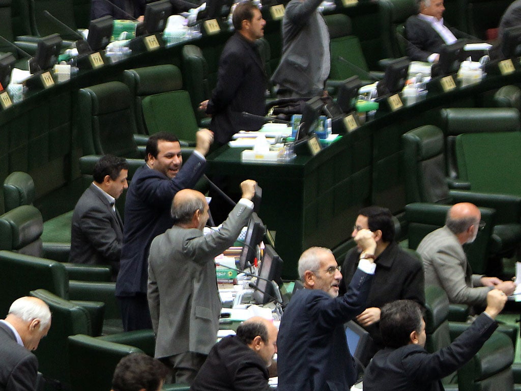 Iranian MPs shouting slogans against the UK during the parliamentary session at which the decision was
made yesterday. The move has yet to be approved by the Guardian Council