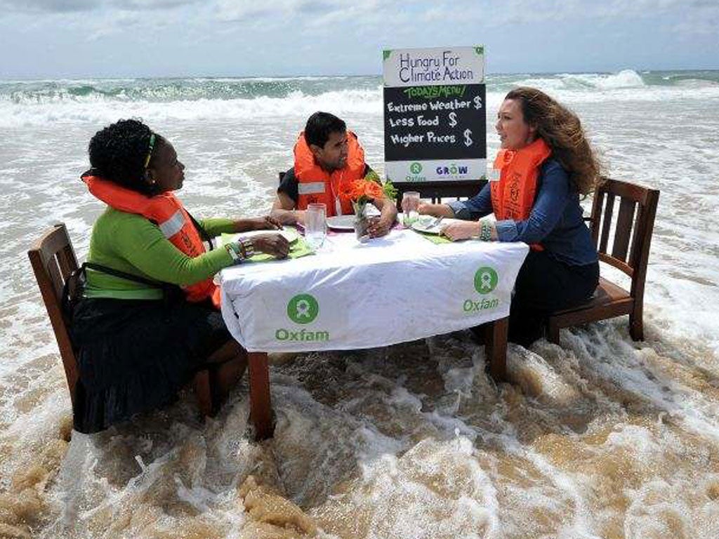 Oxfam activists protest close to the UN conference on climate change in Durban yesterday