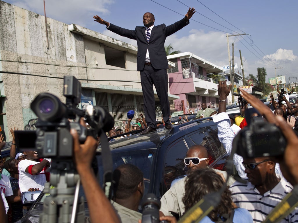 Wyclef Jean greets supporters as a Haiti Presidential candidate in Port-au-Prince last year