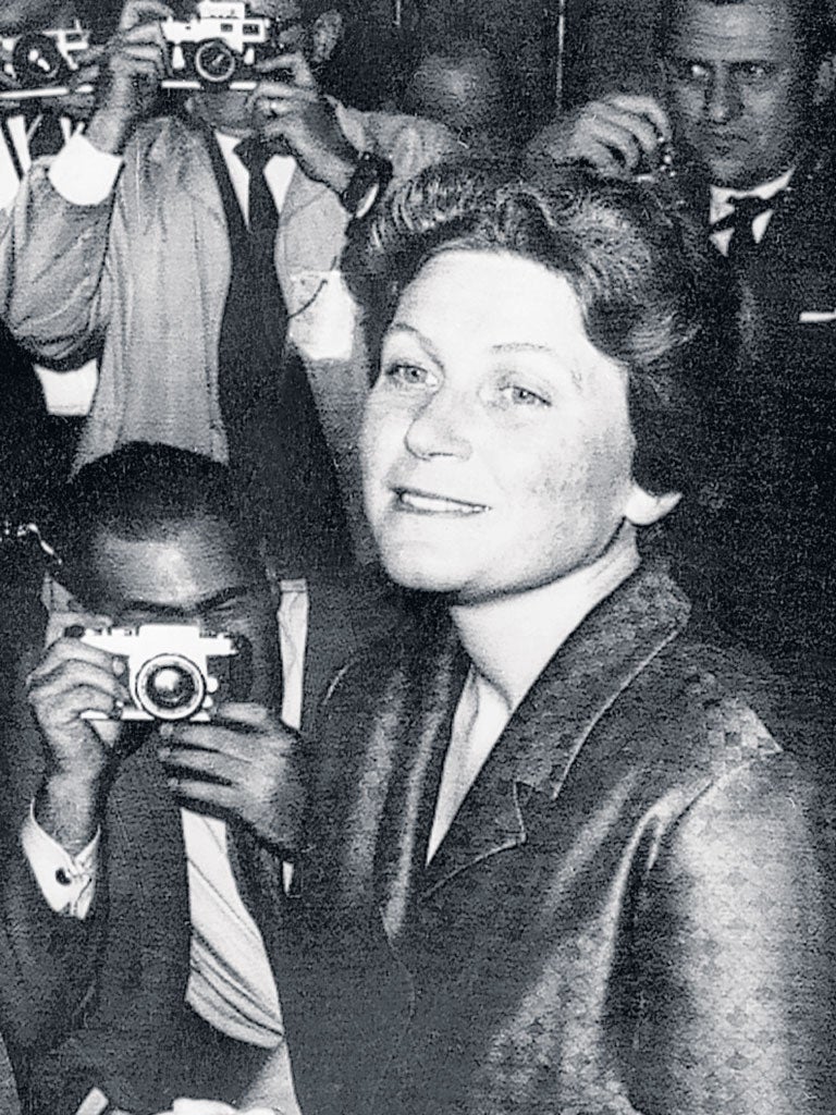 Peters talks to reporters in New York after her defection in 1967