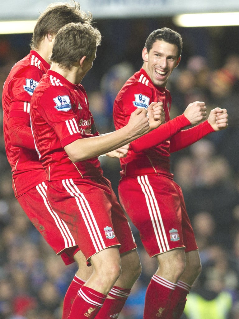 Liverpool players join Maxi Rodriguez (right) in celebration of his goal