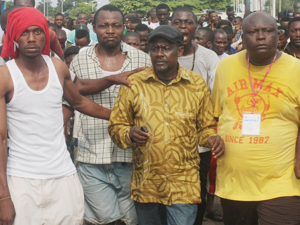 Opposition leader Franck Diongo, centre, protests in Kinshasa