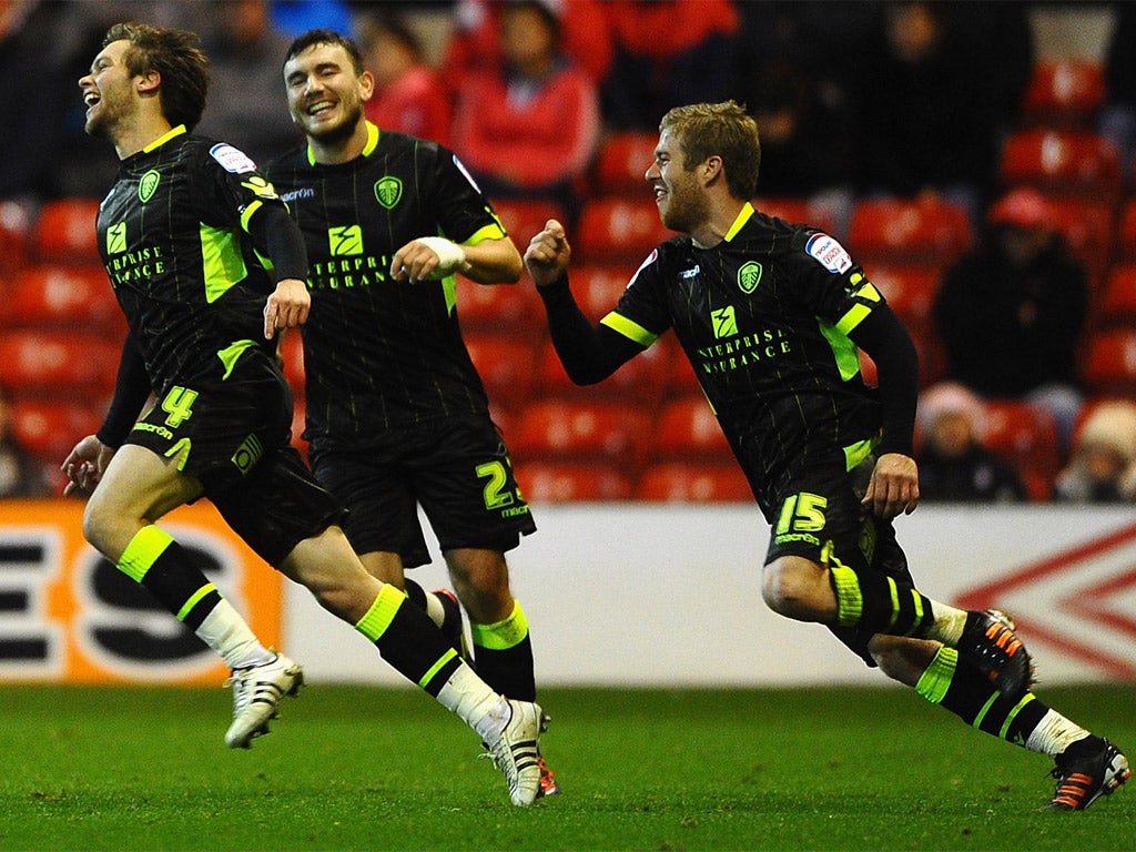 Jonathan Howson (far left) celebrates scoring Leeds' second goal