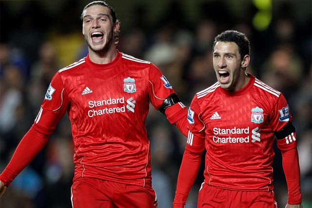 Maxi Rodriguez (right) celebrates giving Liverpool the lead with Andy Carroll