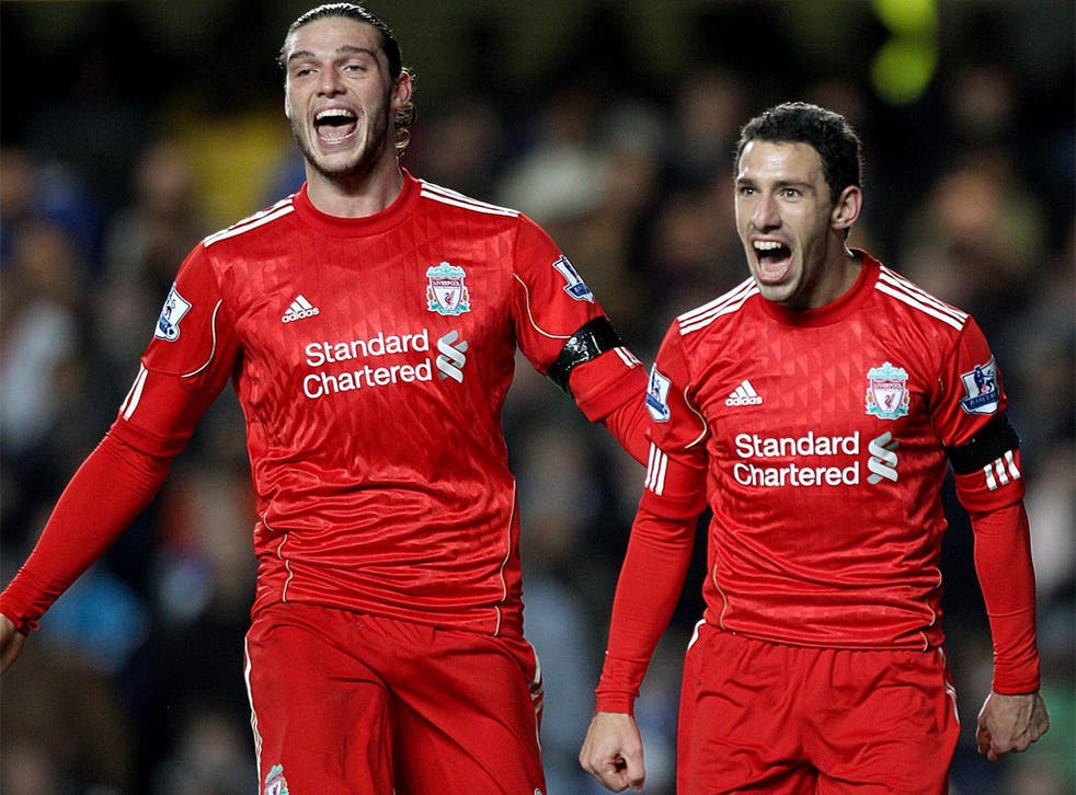 Maxi Rodriguez (right) celebrates giving Liverpool the lead with Andy Carroll