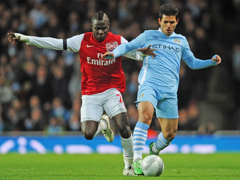 Sergio Aguero (right) who scored Manchester City's winner, takes on Emmanuel Frimpong