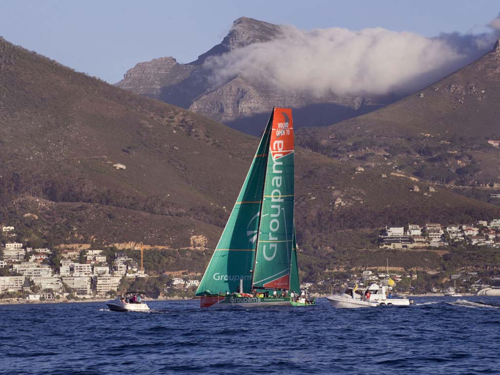 The French yacht Groupama 4 sails slowly in very light wind into Table Bay