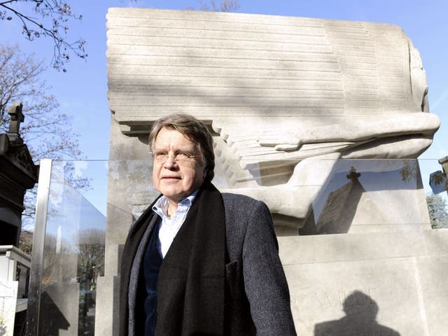 Merlin Holland, the only grandson of Oscar Wilde, at
the writer's restored tomb yesterday