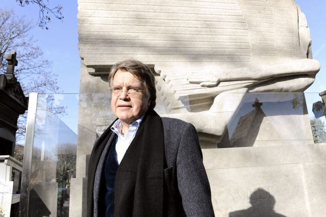Merlin Holland, the only grandson of Oscar Wilde, at
the writer's restored tomb yesterday