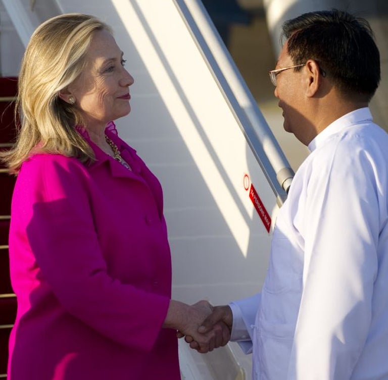 US Secretary of State Hillary Clinton shakes hands with Myanmar Deputy Foreign Minister Myo Myint