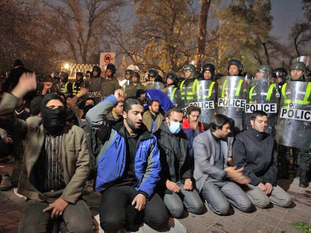 Police guard the British embassy in Tehran