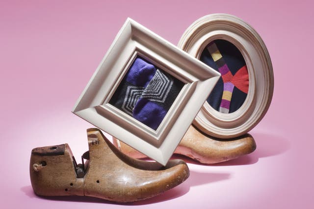 1. Wooden shoe lasts, £49.95, Selfridges; purple patterned socks, £17, Paul Smith; Duchamp multi-striped socks, £16.95, Harrods; oval frame, £11, and square frame, £9, John Lewis
