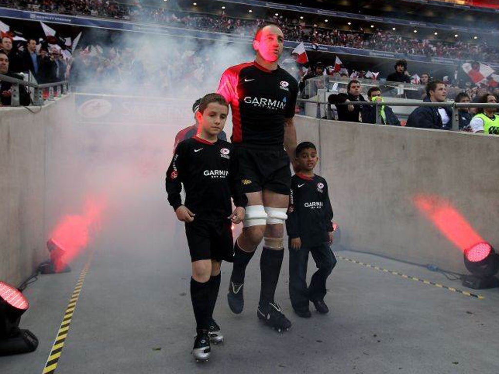 Saracens' Steve Borthwick leads the teams and mascots down the tunnel for a Heineken Cup match against Leinster at Wembley Stadium in 2010