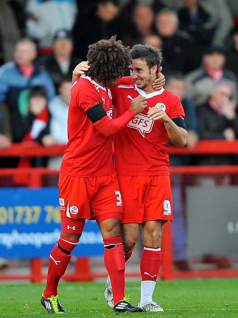 Matt Tubbs, right, scored a hat-trick in the League Two pacemakers' 5-0 romp