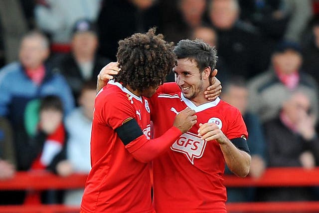 Matt Tubbs, right, scored a hat-trick in the League Two pacemakers' 5-0 romp